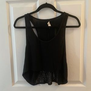 LSPACE black razor back crop top size small. Open sides . L*space